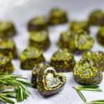 Chocolate truffles shaped like hearts, with green cocoa butter