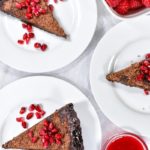 Slices of pie decorated with pomegranate seeds