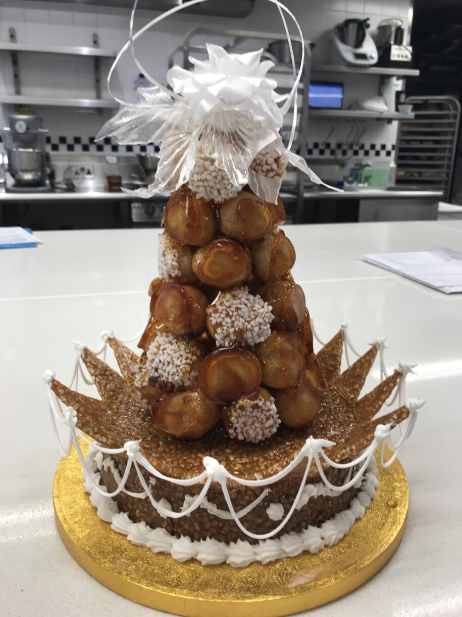 Croquembouche with pulled sugar rose in the kitchen at Le Cordon Bleu