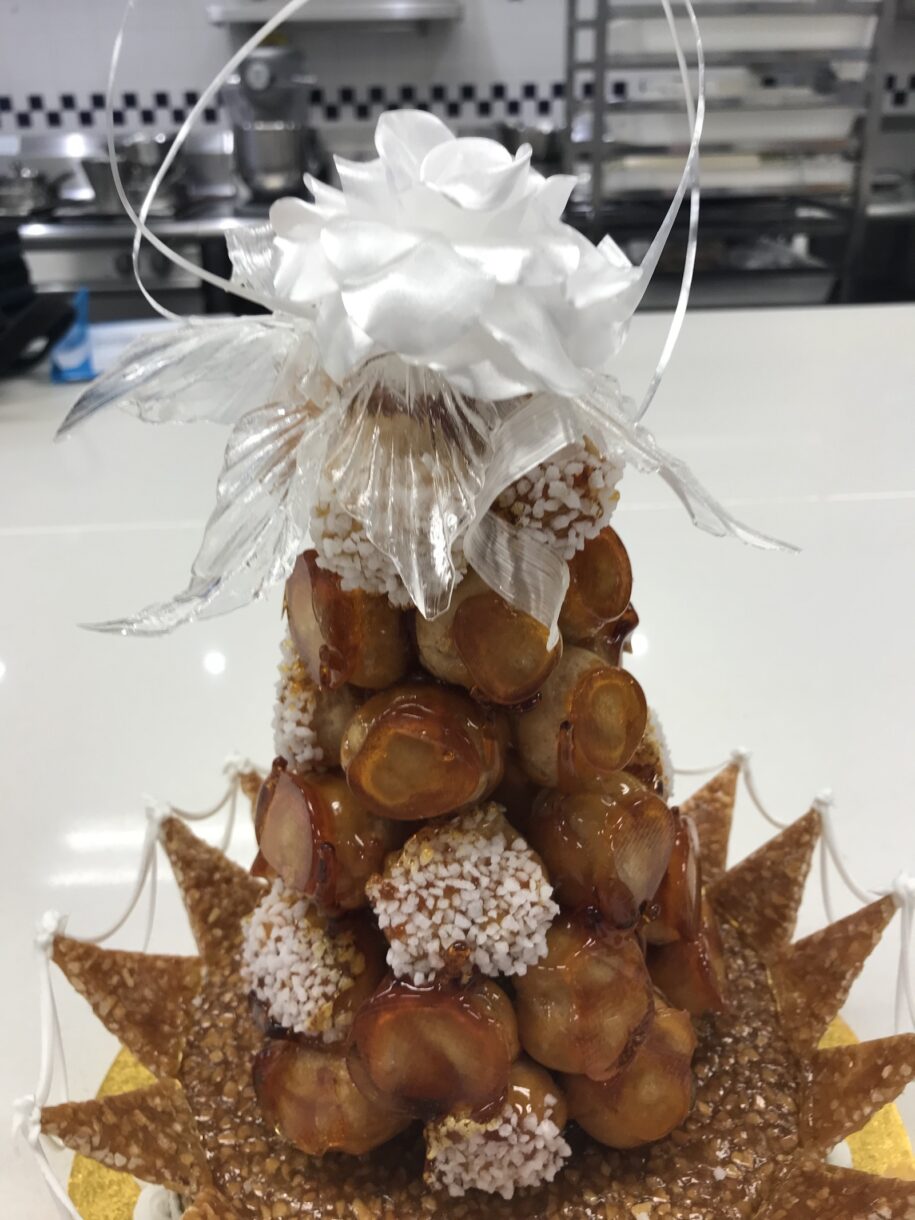 Croquembouche wedding cake with white pulled sugar rose
