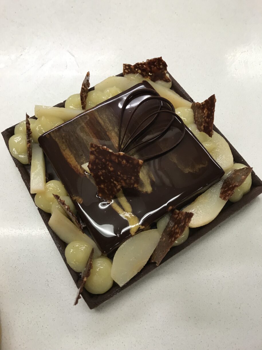 A square chocolate tart with pears