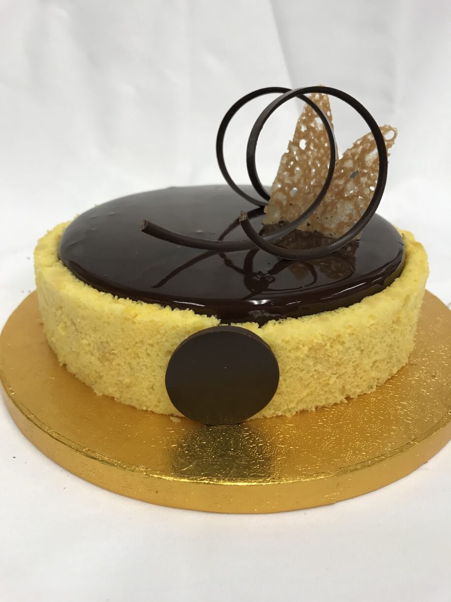 My entremet from the mock exam in Superior Patisserie at Le Cordon Bleu, featuring chocolate glacage and sponge cake