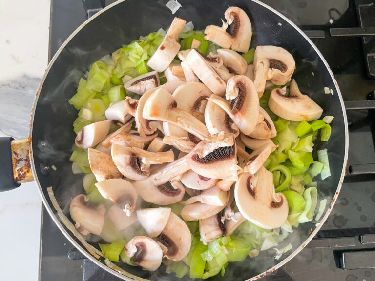 Mushrooms and leeks in a pan