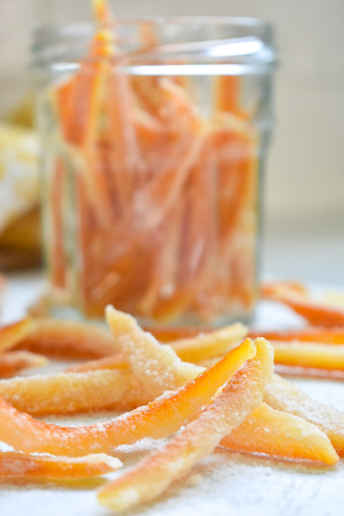 Candied orange peels in a glass jar