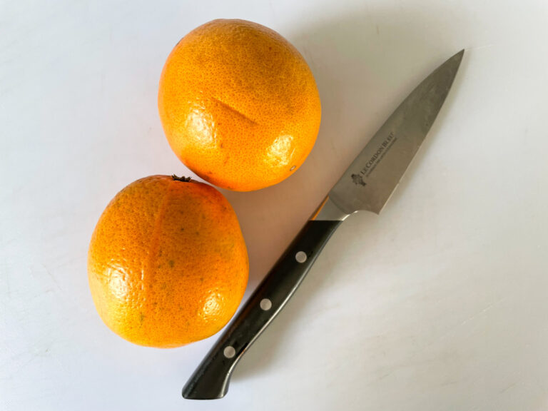 Two oranges and a knife