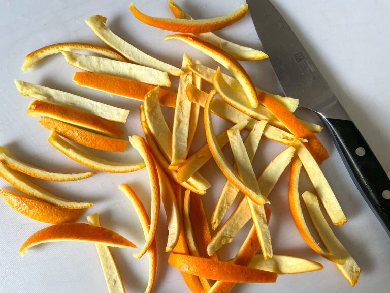 Orange peel strips on a cutting board