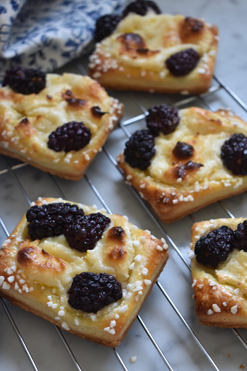 Blackberry cream cheese pastries on wire rack