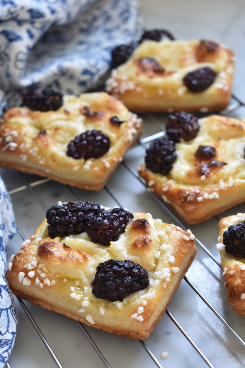 Blackberry cream cheese pastries on a cooling rack