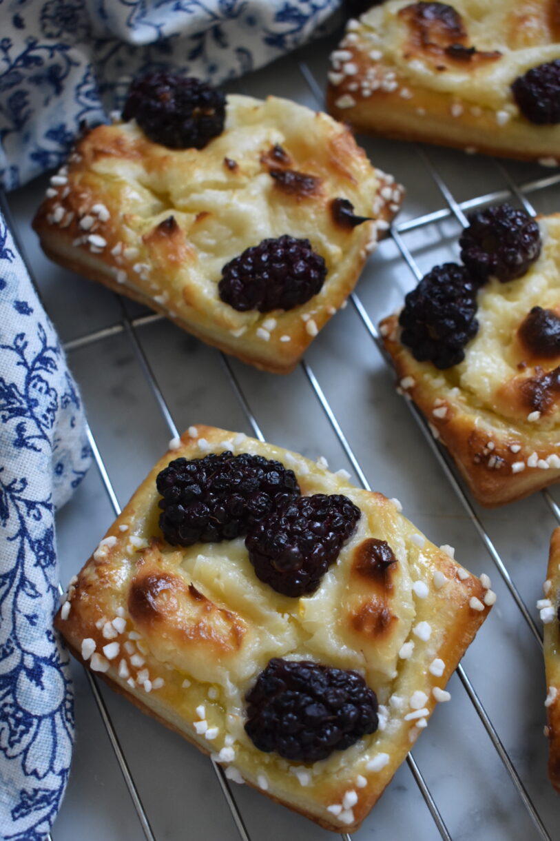 Blackberry cream cheese pastries on a wire rack