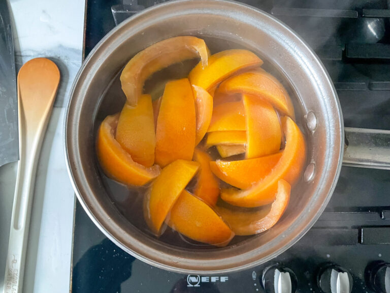Grapefruit peels in saucepan on stovetop