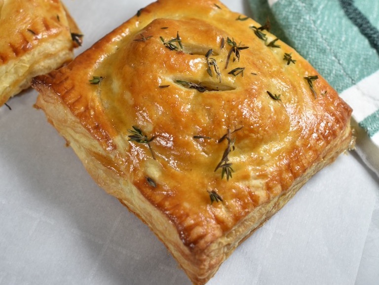 A savoery hand pie sprinkled with fresh thyme