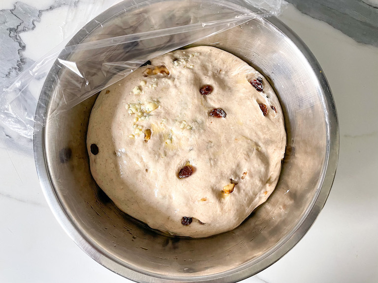 Risen bread dough in a bowl