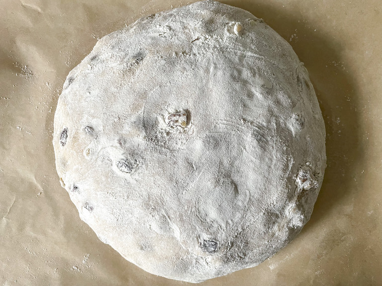 Risen bread dough coated in flour
