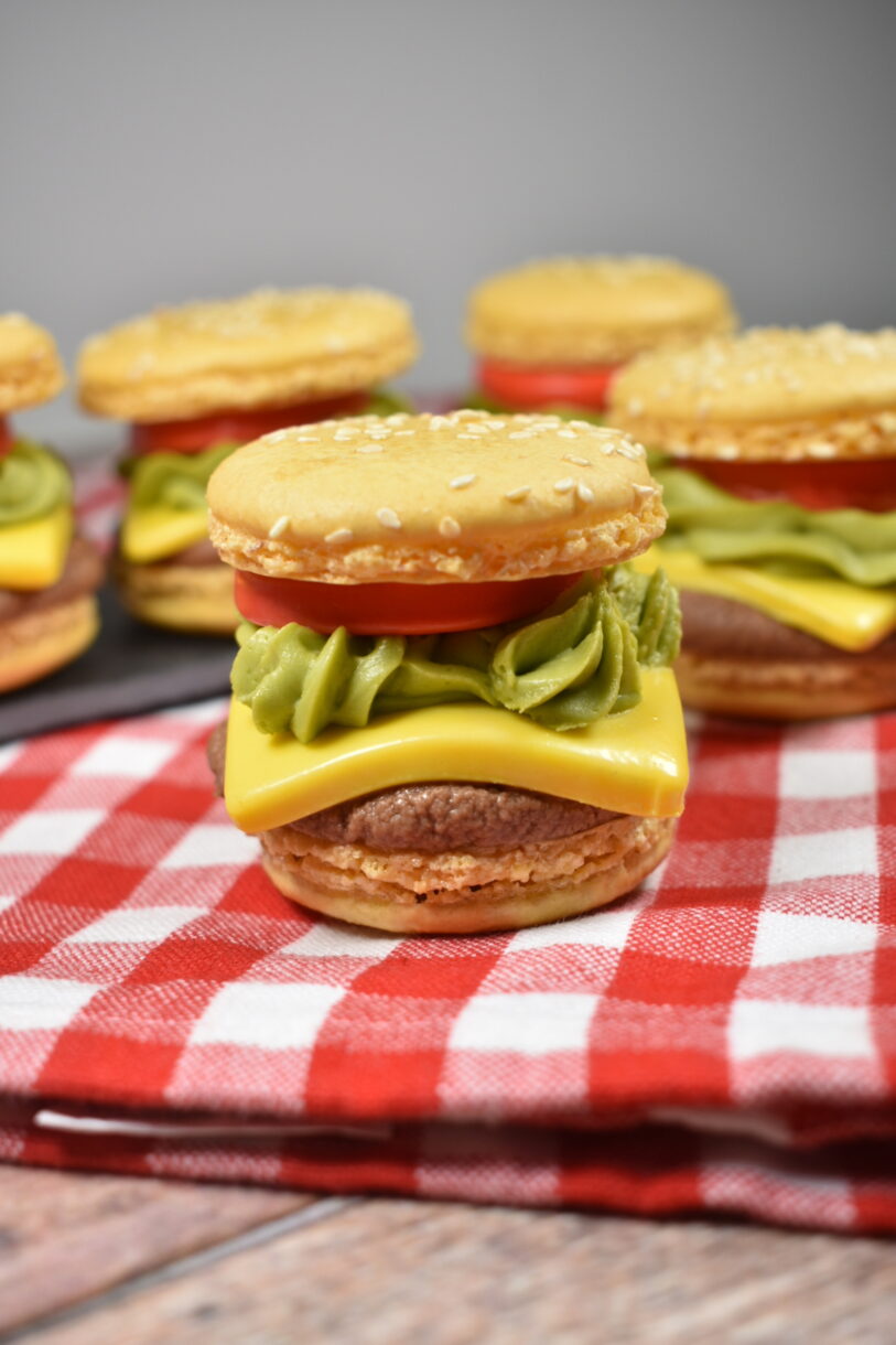 Cheeseburger macarons on a red towel