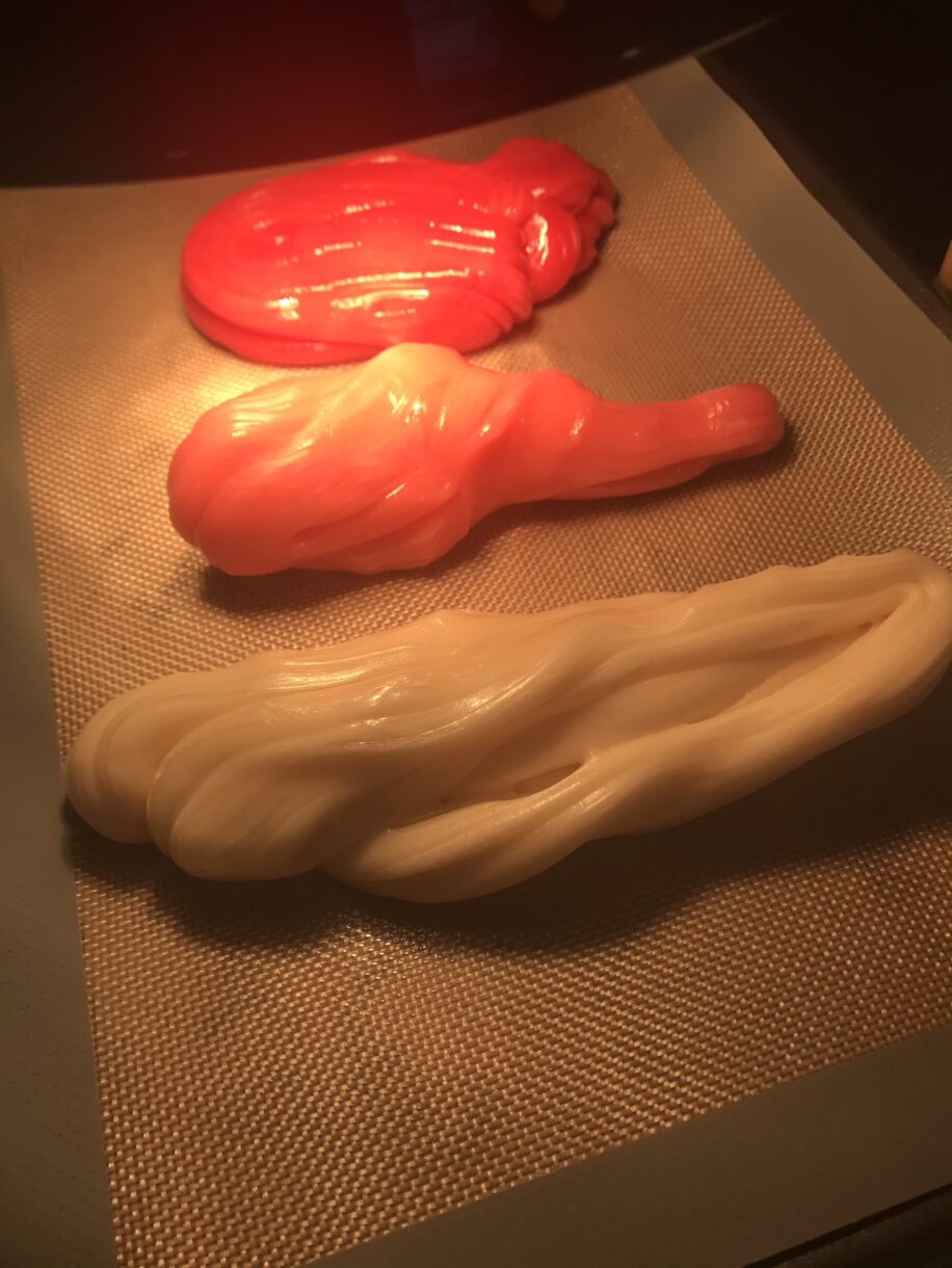 Pulled sugar on a silicone mat under a lamp