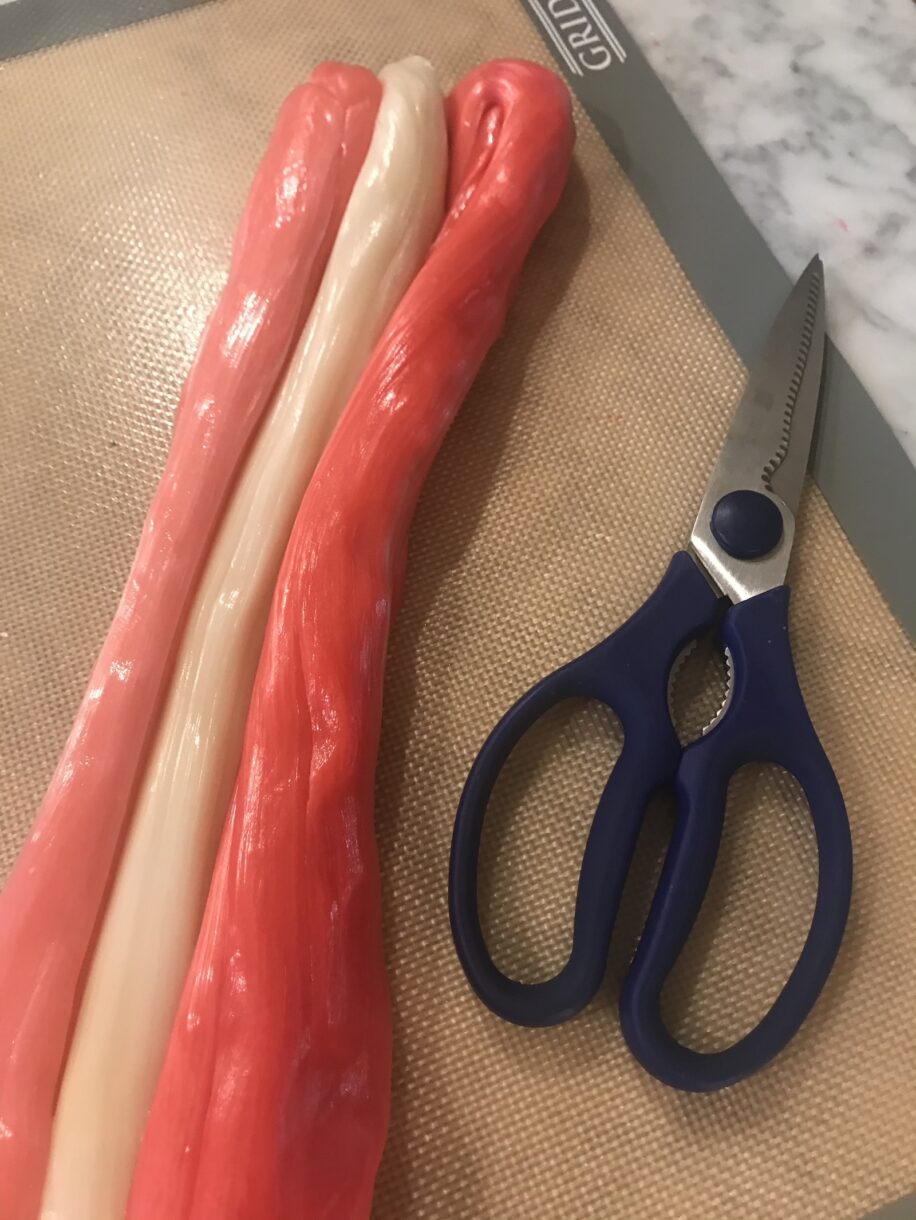 A silicone mat with pulled sugar and scissors