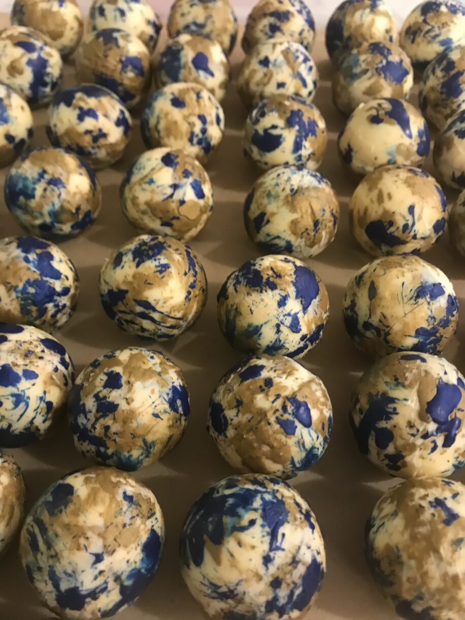 Salted caramel hot chocolate bombs with blue and gold decoration