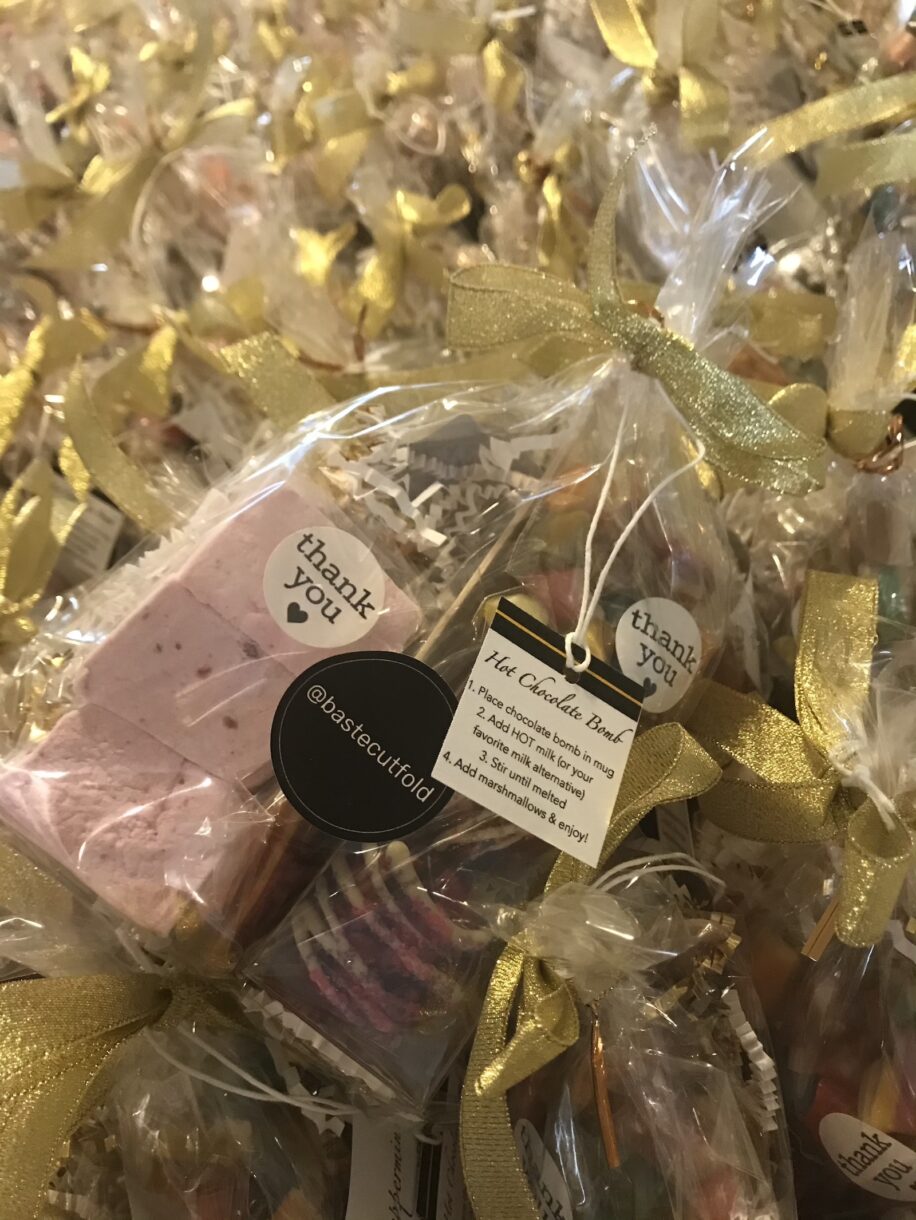 Hot chocolate bombs in packaging with gold ribbon and bastecutfold sticker