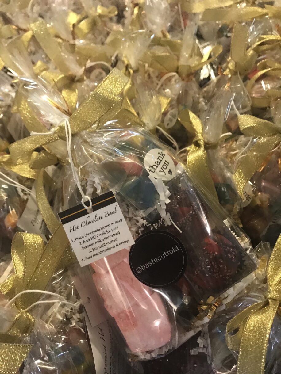 A clear bag with homemade marshmallows and hot chocolate bombs