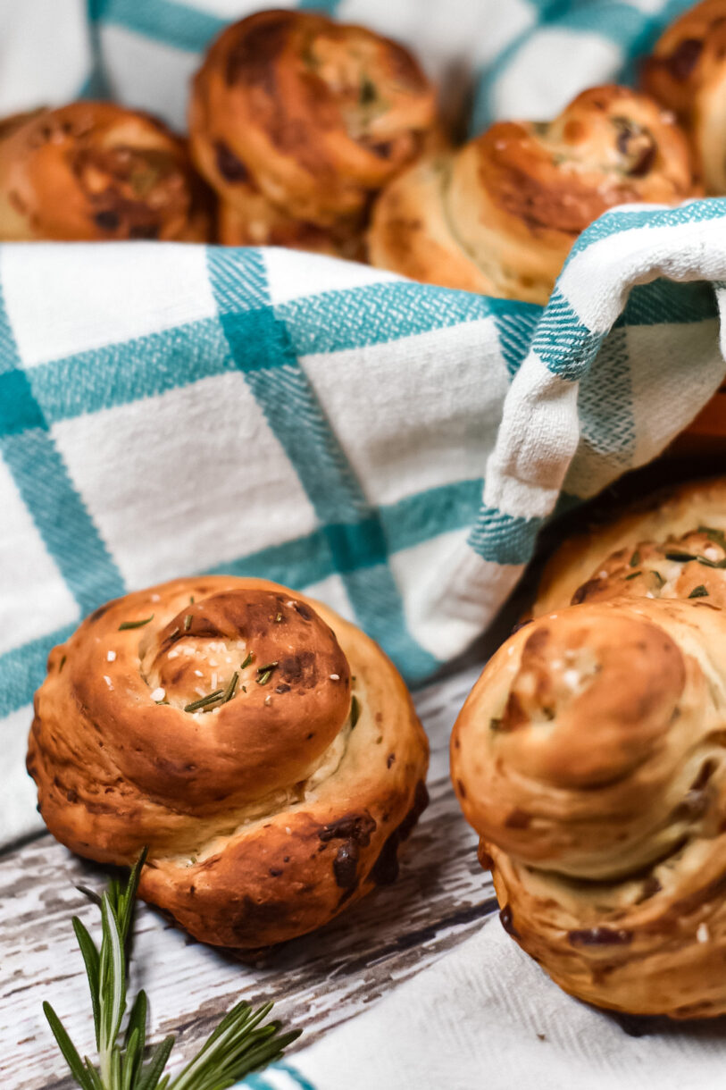 Bleu cheese, date, and rosemary bread rolls in a basket