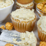 Vanilla cupcakes, caramel popcorn buttercream, and pieces of caramel corn