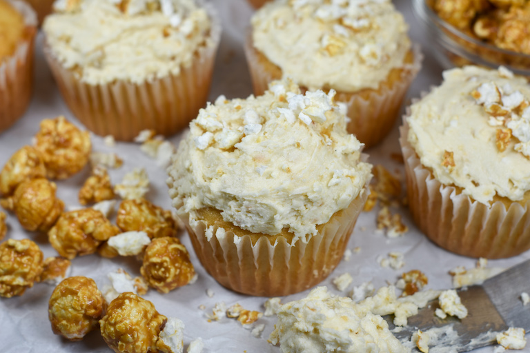 cupcakes frosted with caramel popcorn buttercream