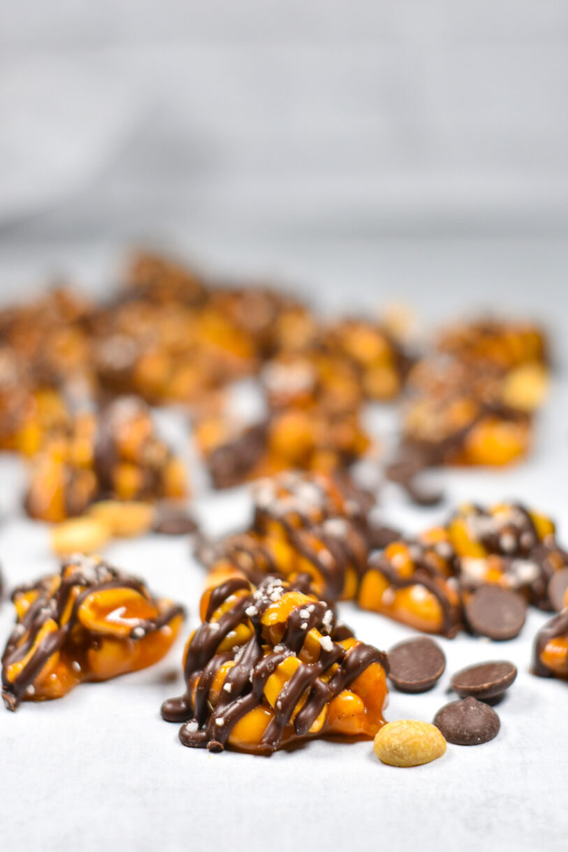 Chocolate Covered Peanuts and chocolate chips on a white background