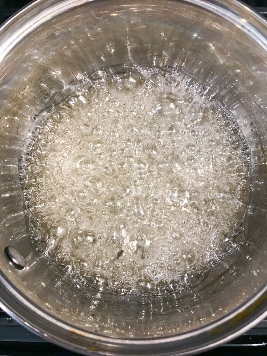 Sugar boiling in a metal saucepan