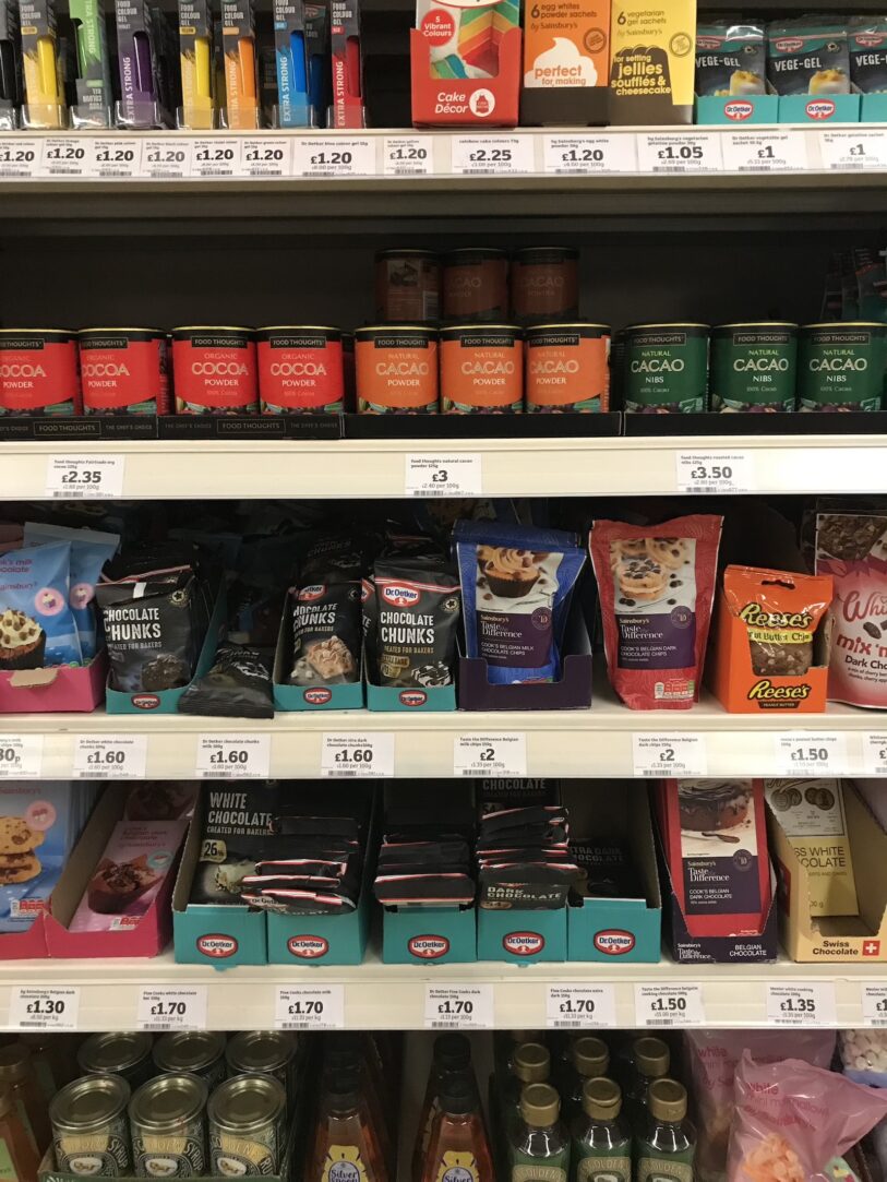 Products on a shelf in the baking aisle at Sainsbury's grocery store in London