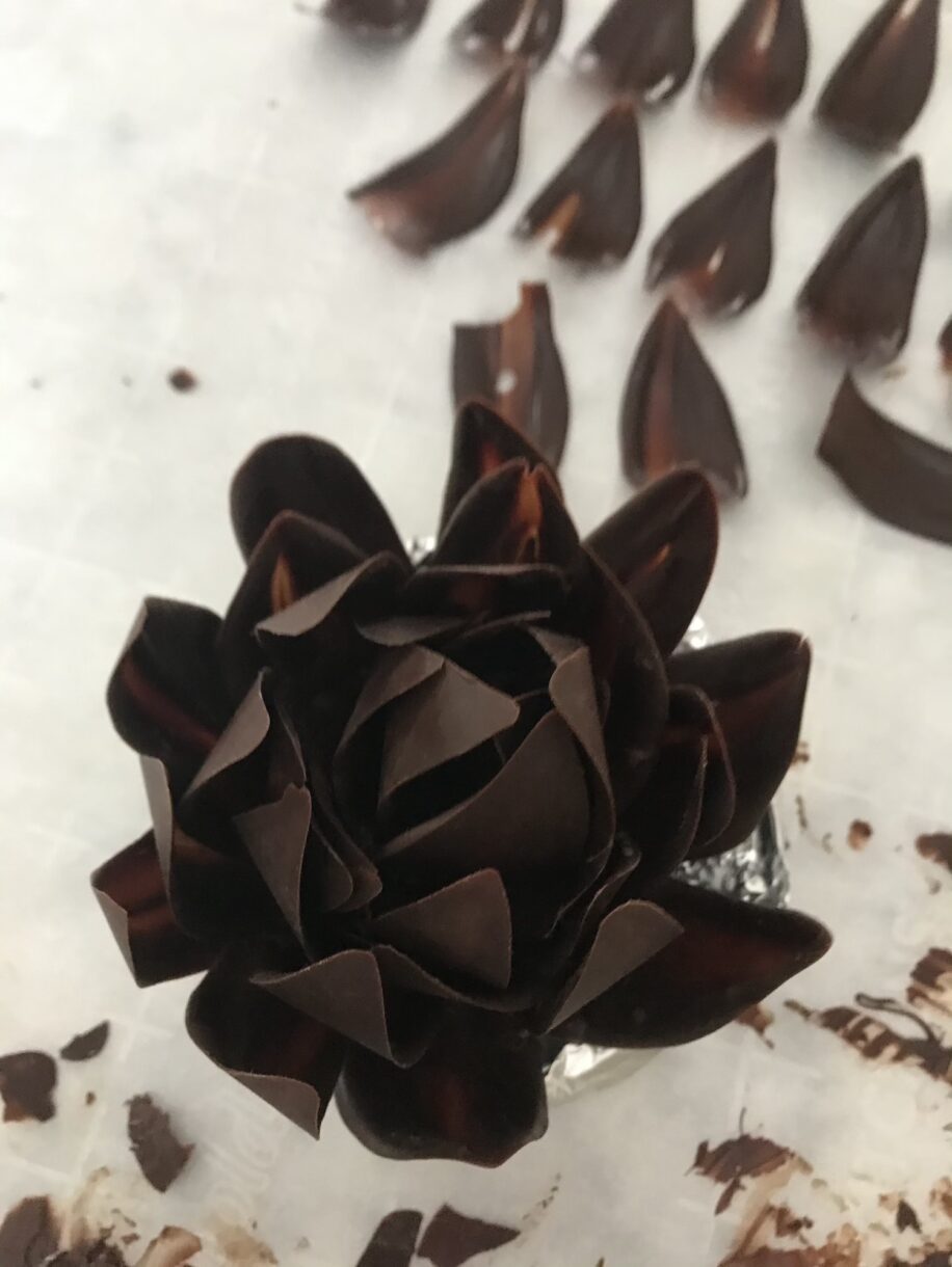 Chocolate flower on a sheet of white parchment