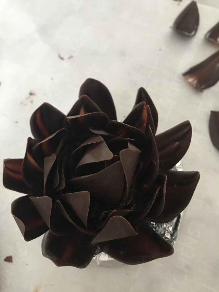 Chocolate flower comprised of individual tempered chocolate petals