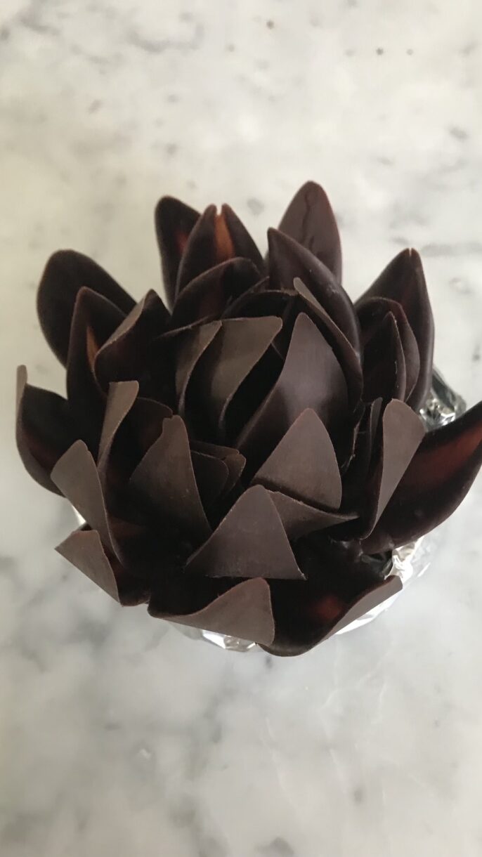Chocolate flower sitting on a foil ring