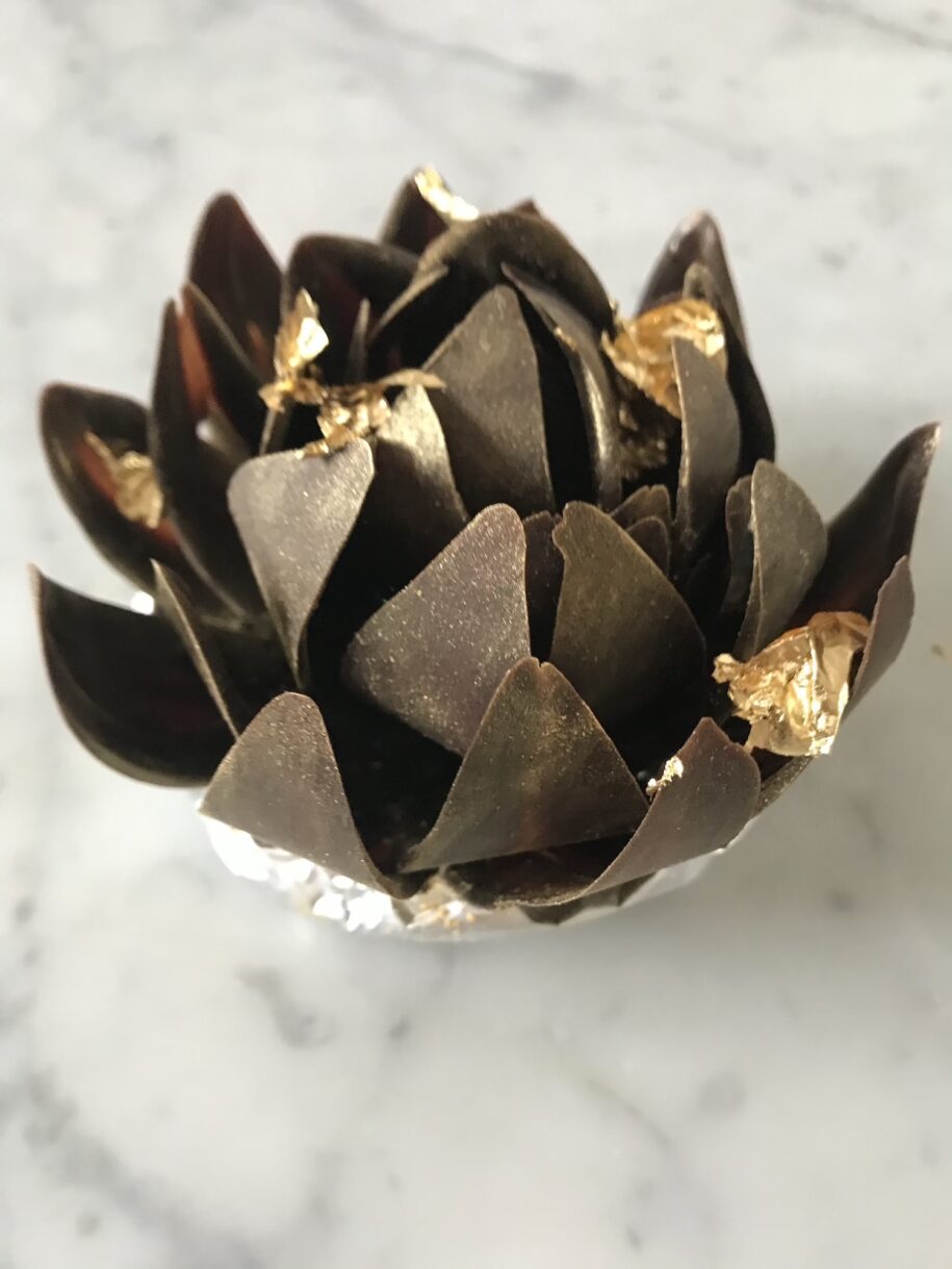 Chocolate rose adorned with gold dust and gold leaf