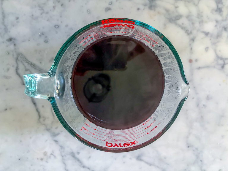 a pitcher of mulled red wine after straining