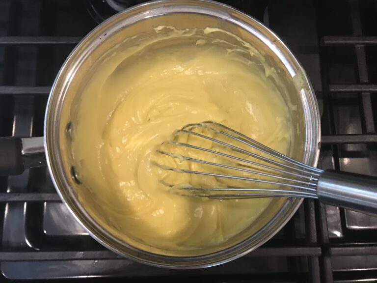 Finished pastry cream in a saucepan on the stovetop