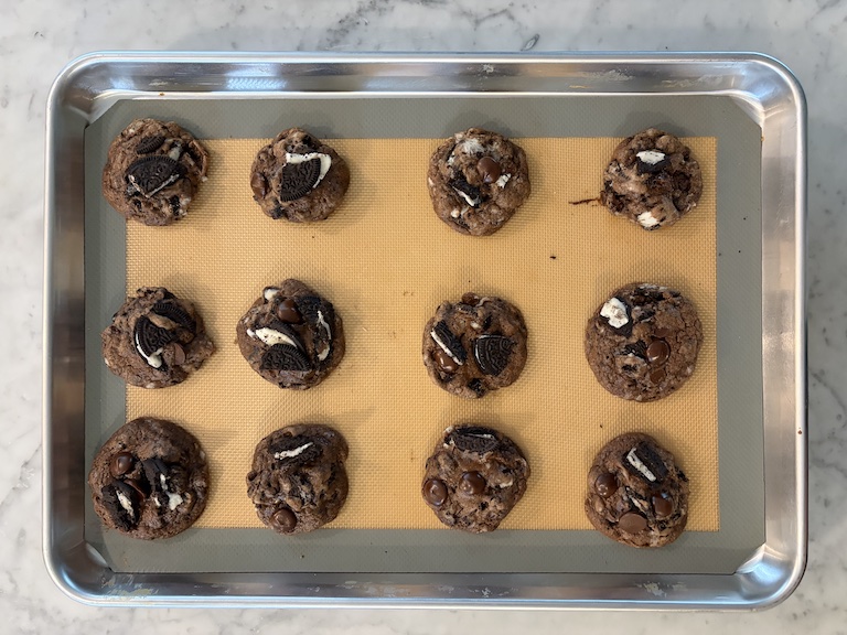 Oreo chocolate chip cookies on a tray after baking