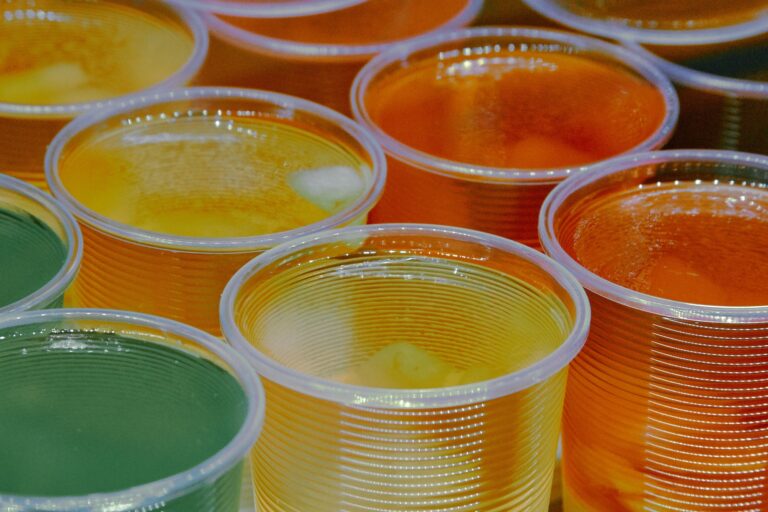 Cups of green, yellow, orange jello gelatin dessert
