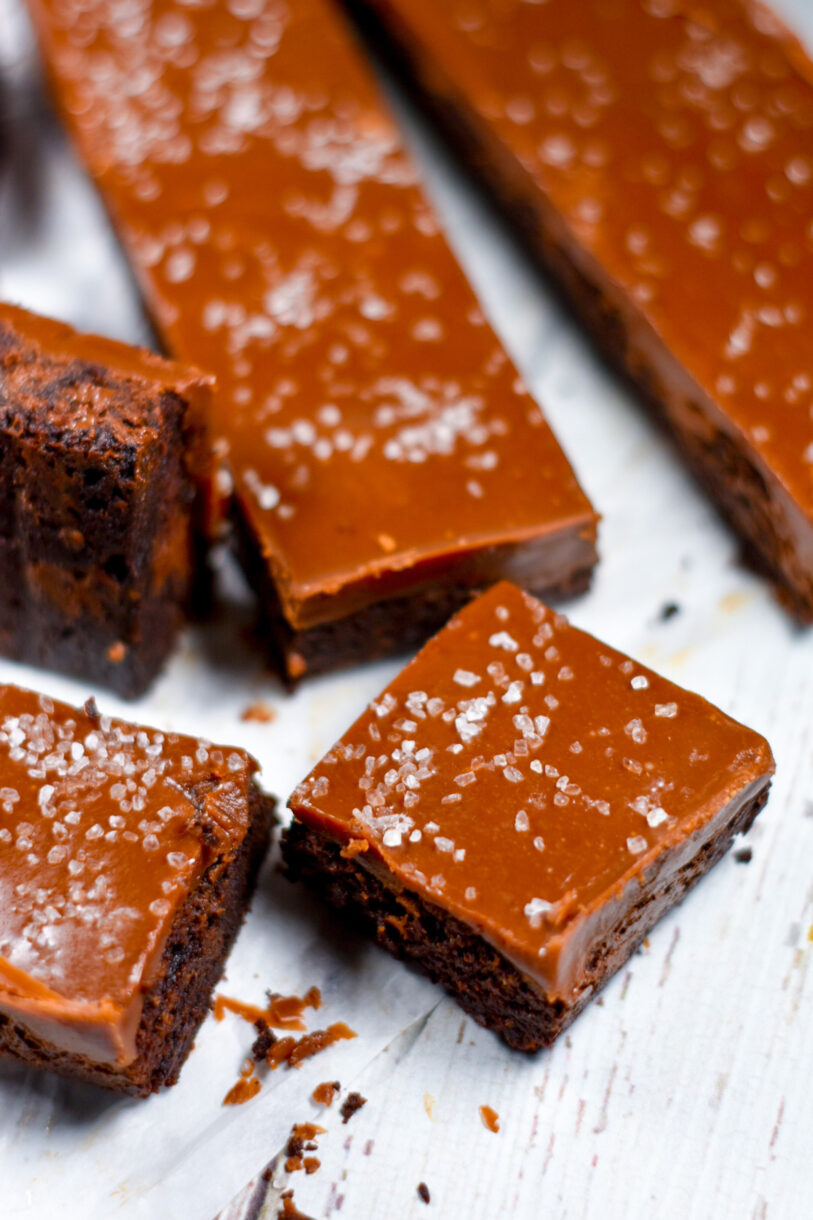 Closeup shot of slabs and squares of salted chocolate caramel brownies 
