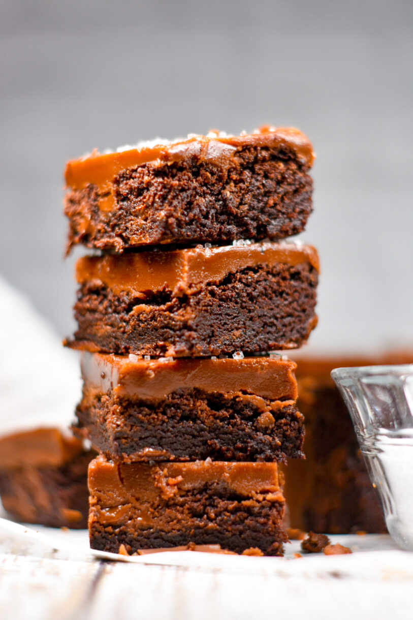 A stack of four salted chocolate caramel brownies