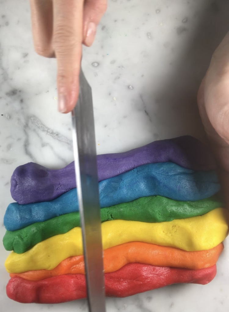 Cutting dough for rainbow cookies