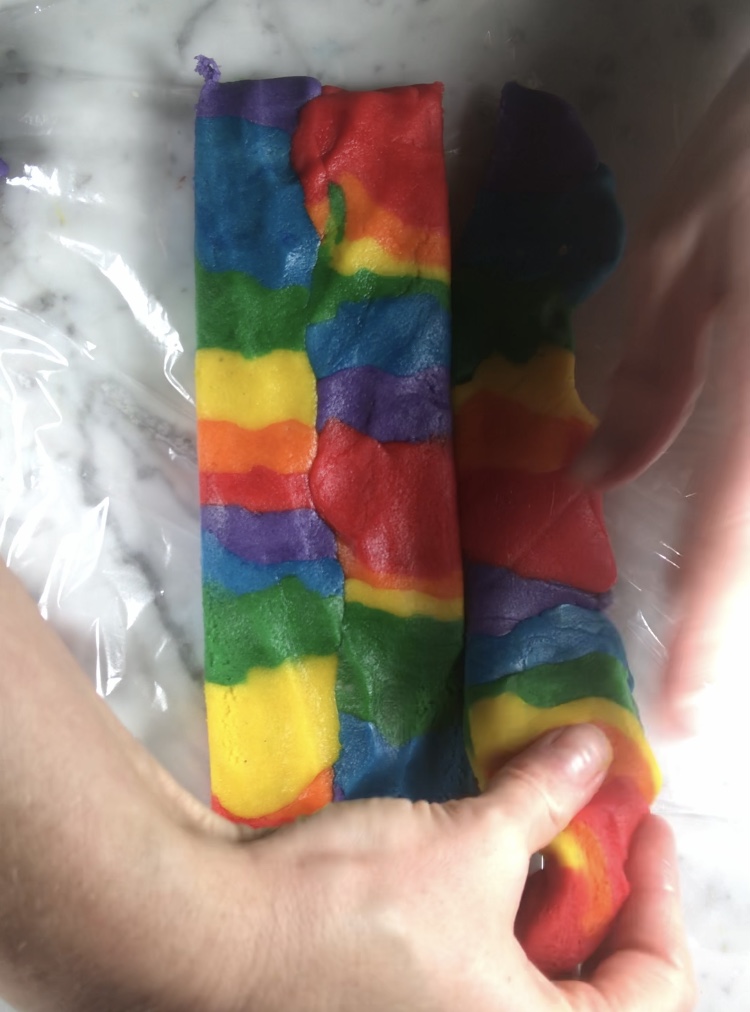 Shaping rainbow dough for donkey cookies