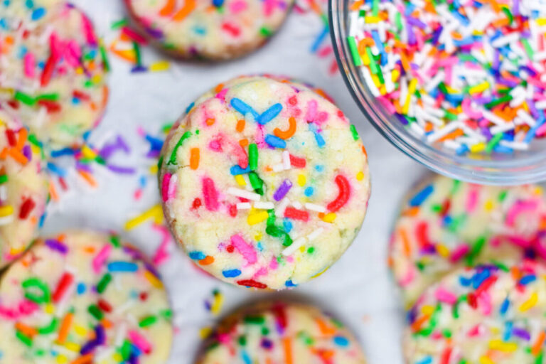 Shortbread cookies with rainbow sprinkles, on a white background