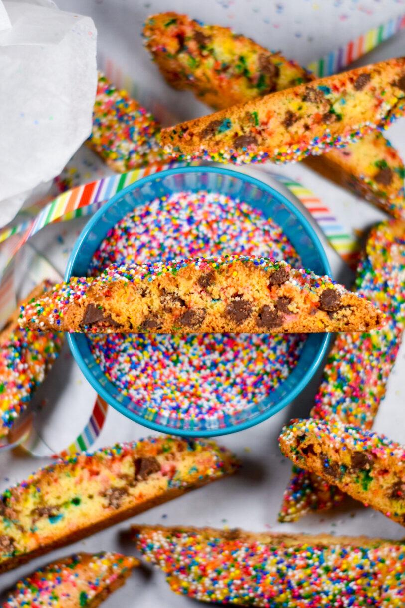 Chocolate chip rainbow biscotti cookies, and a bowl of rainbow nonpareils