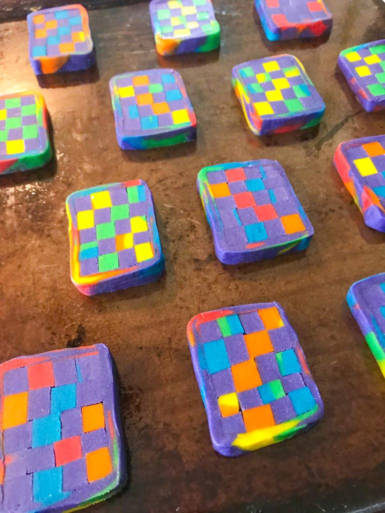 Rainbow checkerboard cookies on a tray