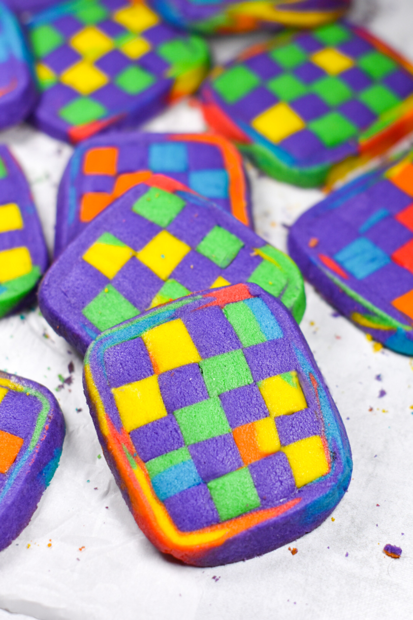 Checkerboard cookies arranged on a white background