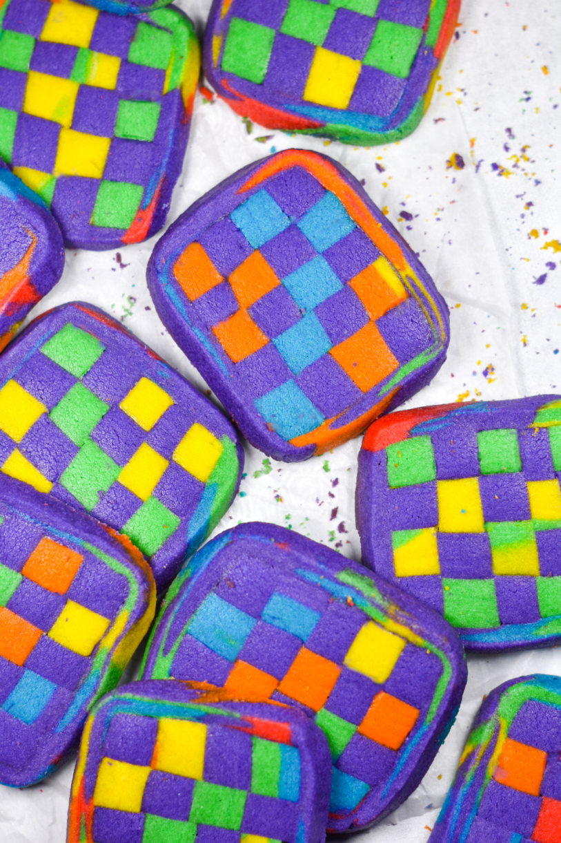 Checkerboard cookies on a white background, with crumbs