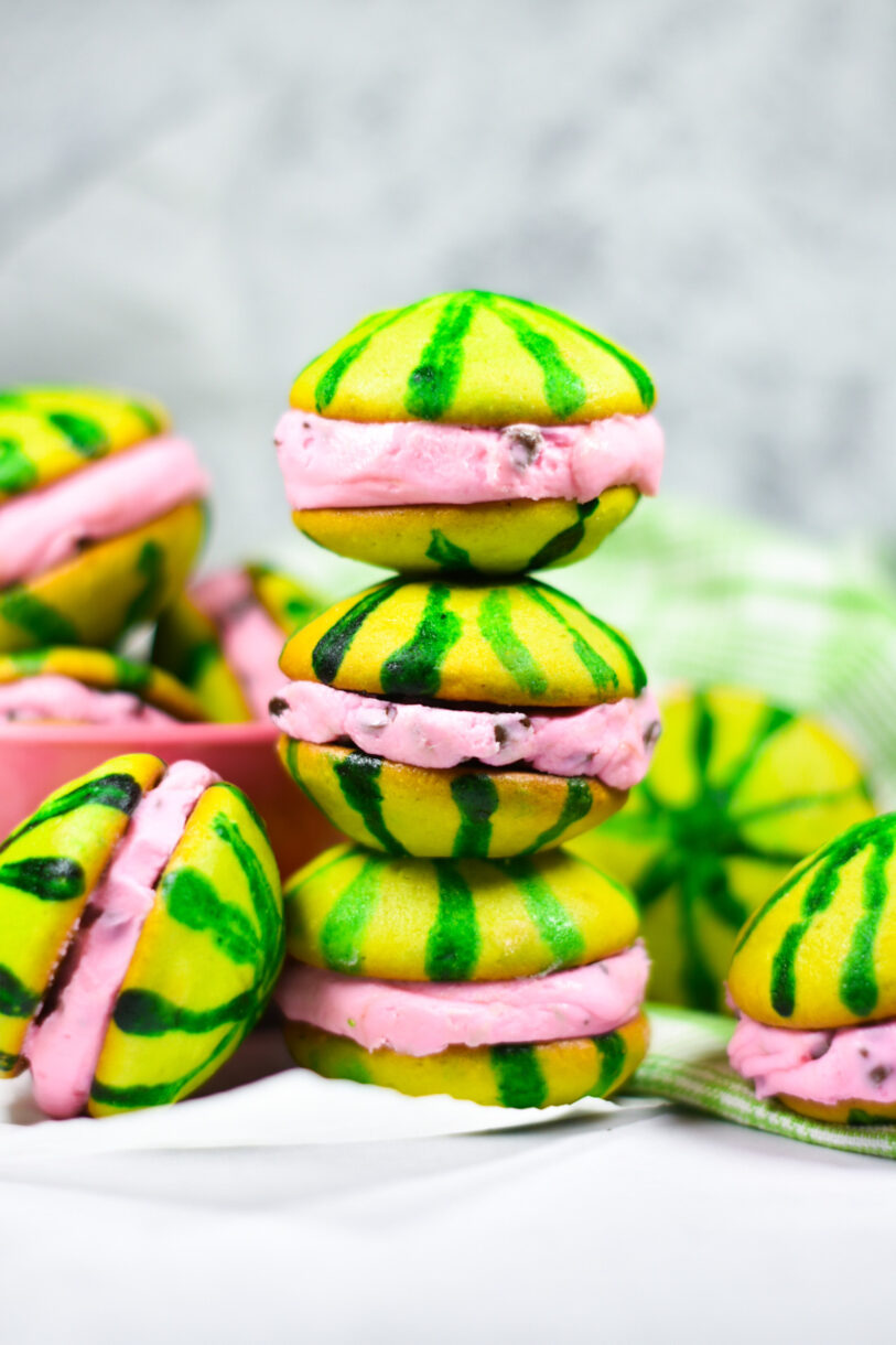 A stack of three watermelon whoopie pies