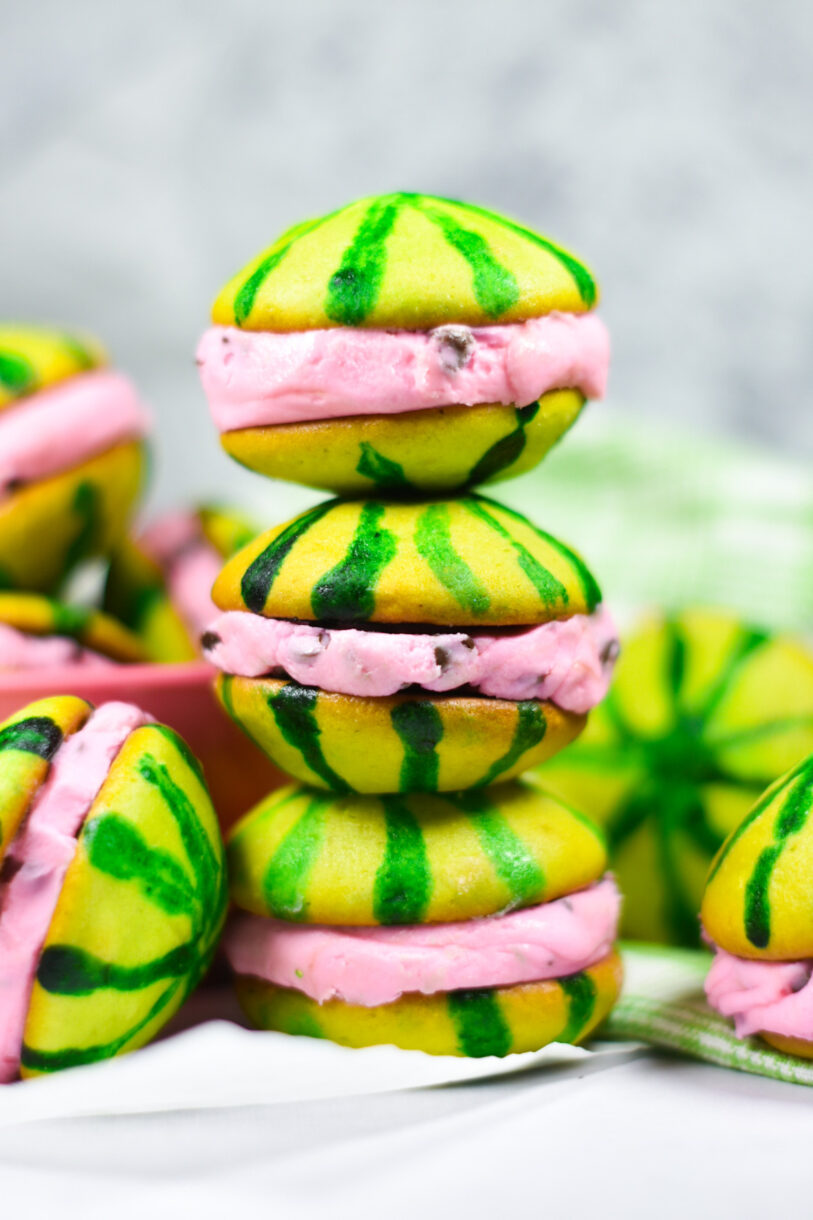 A stack of green watermelon whoopie pies with pink filling