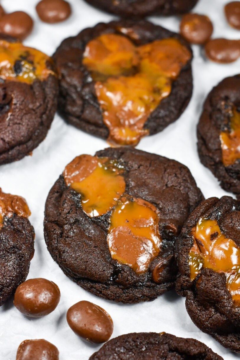 Chocolate Caramel Cookies and Milk Duds on a white background