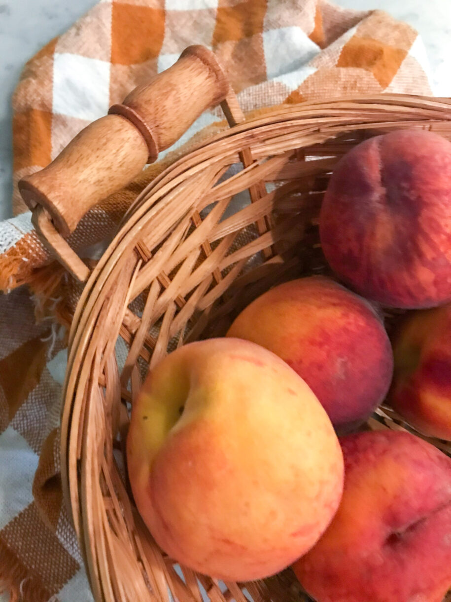 A basket of fresh peaches